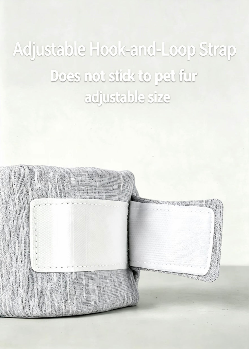 Close-up of the adjustable hook-and-loop closure on a gray pet recovery collar
