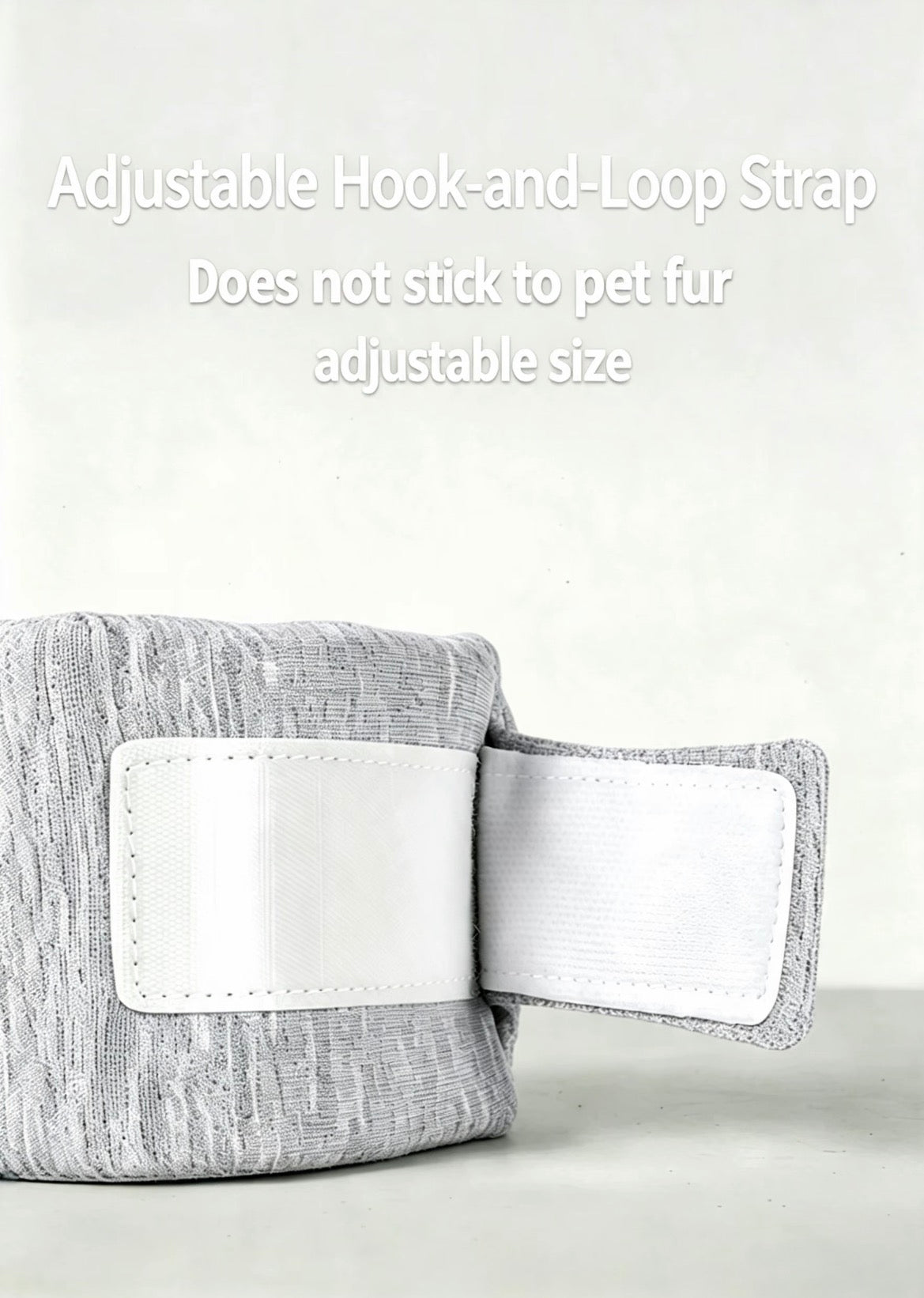 Close-up of the adjustable hook-and-loop closure on a gray pet recovery collar