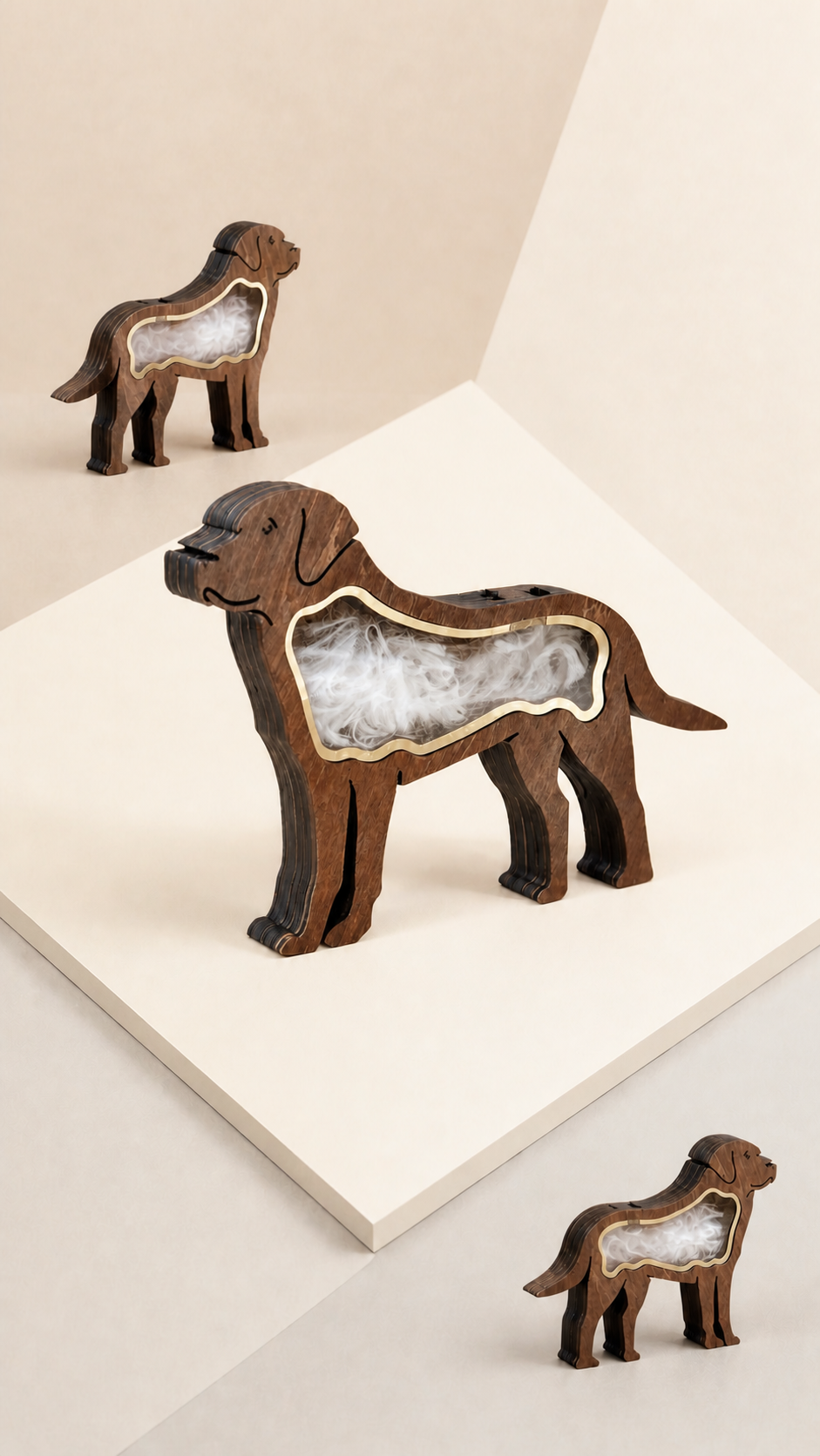 Dog-shaped Pet Hair Keepsake Boxes in three sizes on a neutral display